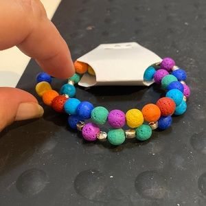 Two multicolored polymer beaded bracelets. 6 1/2 inches with stretchy bands.